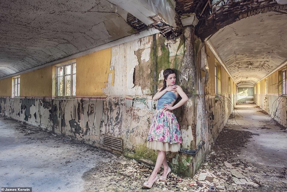Jade in 2015  modelling a floral dress while leaning against a wall inside the abandoned Severalls Asylum in Colchester, Essex