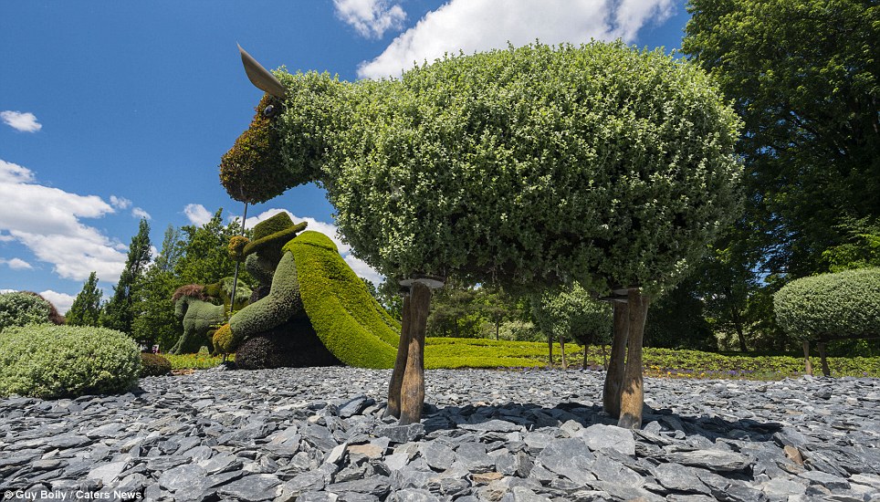 A resting shepherd and his flock sit atop a carpet of shale in this entry. Contestants were asked to include examples of man and nature being interdependent as part of the Land of Hope theme