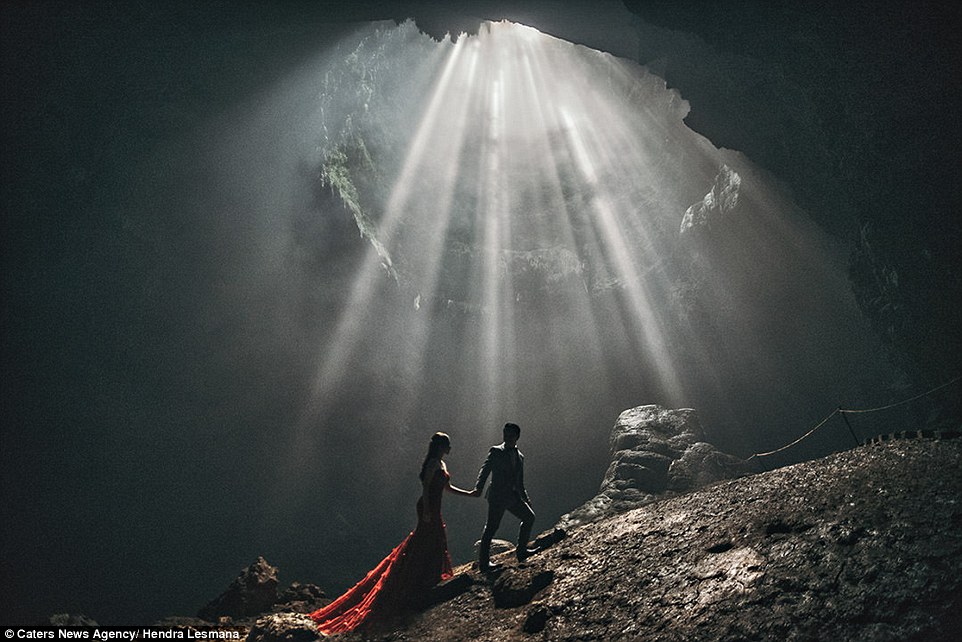 A dramatic photo snapped by Hendra Lesmana sees a couple pose in a cave in Jarkata Indonesia 