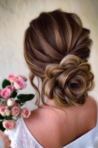 classical wedding hairstyles low flower shaped updo with samirasjewelry